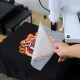 Industrial-grade Hot Melt Adhesive DTF Powder applied on various fabric types including swimsuit and cotton materials.