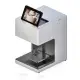 High-speed coffee printer printing intricate self-serving drink designs with FDA-certified food-grade ink.
