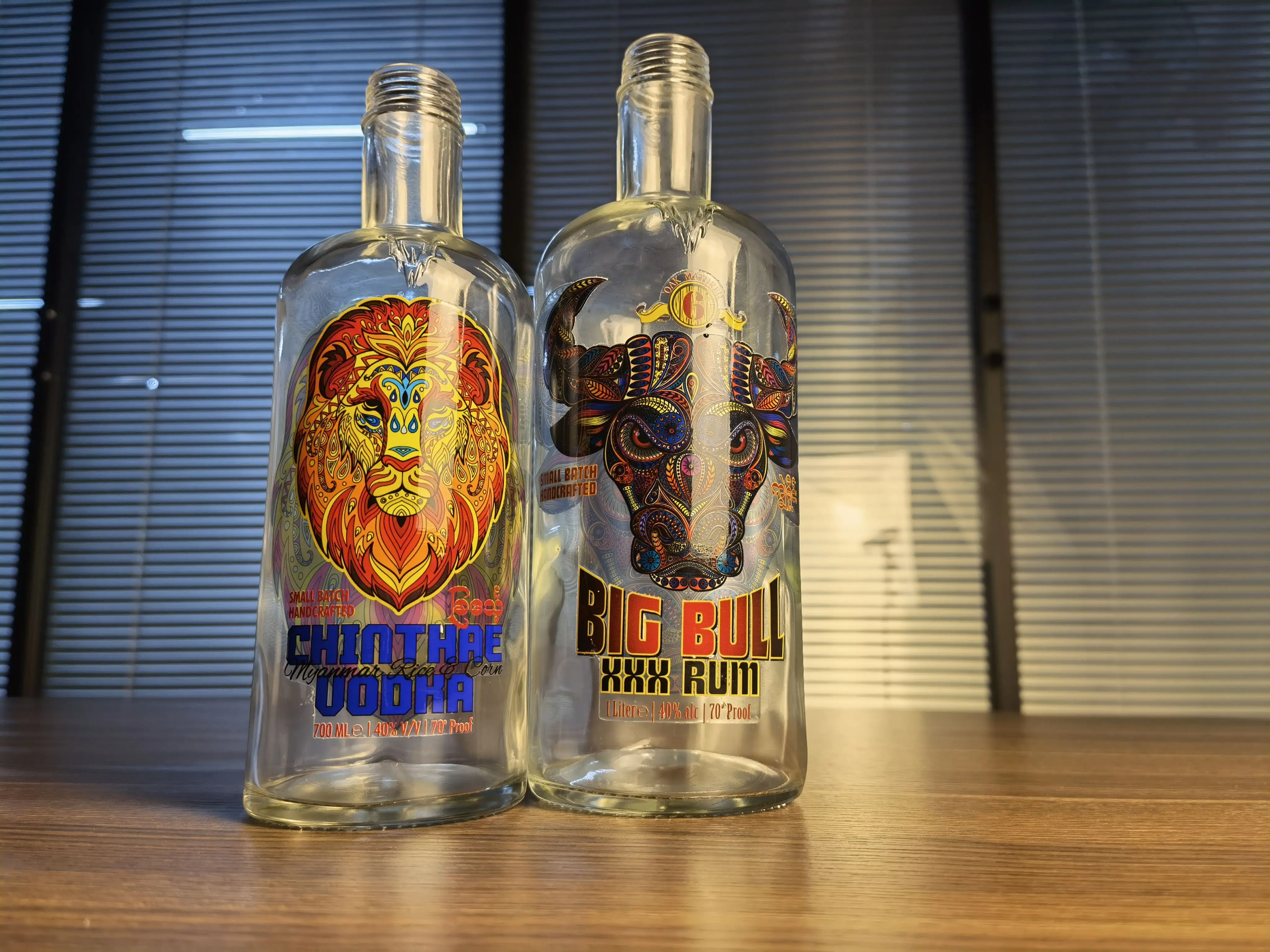UV DTF stickers applied on curved glass and bottles