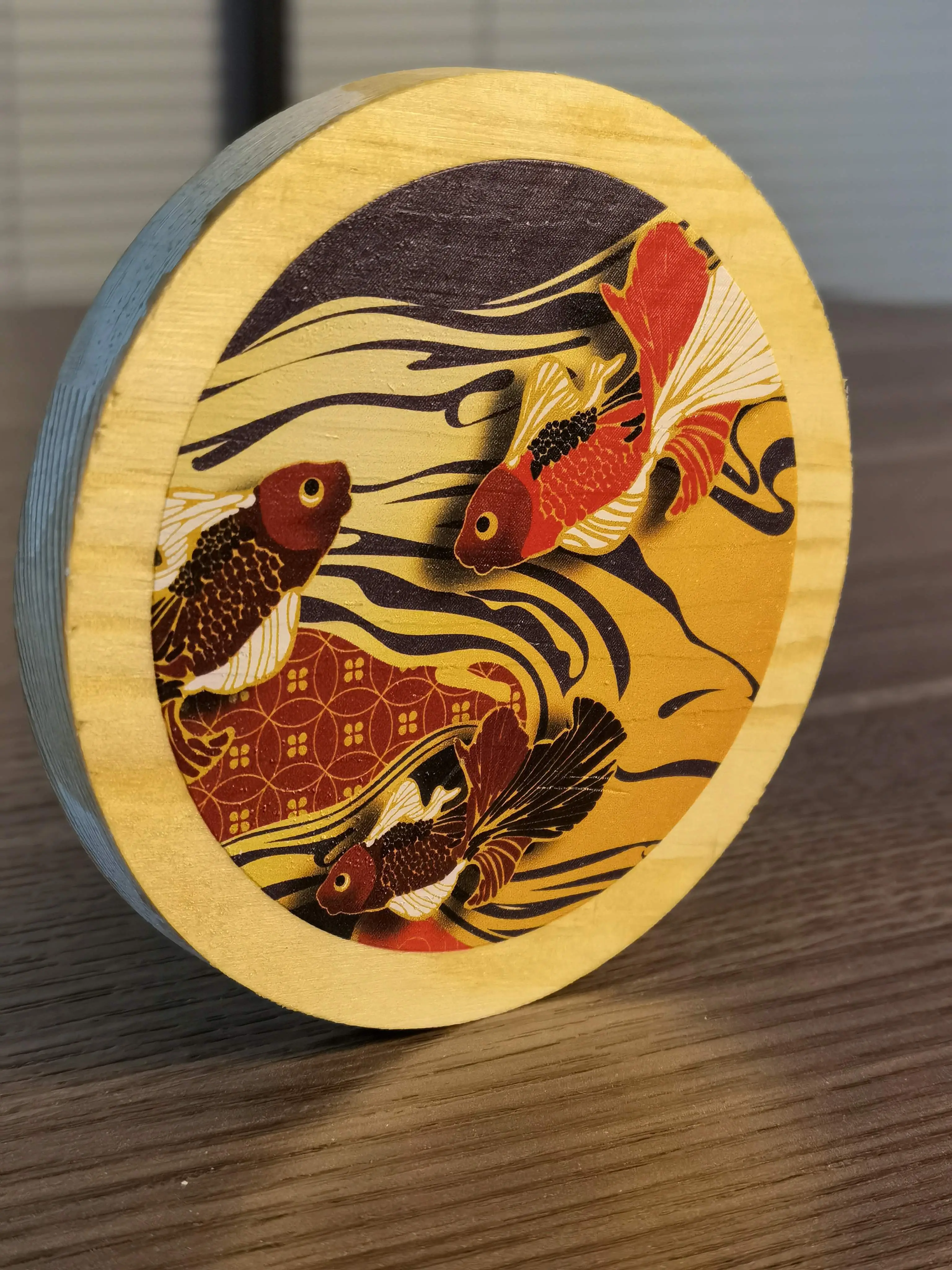 UV printed natural wood disk with goldfish design